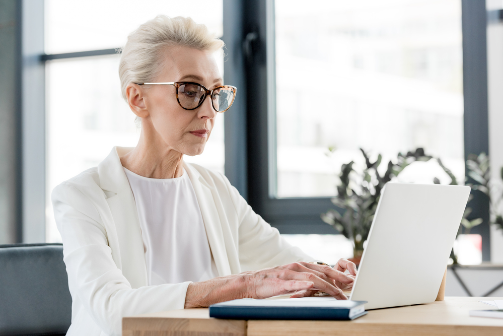 Senior citizen at work in office